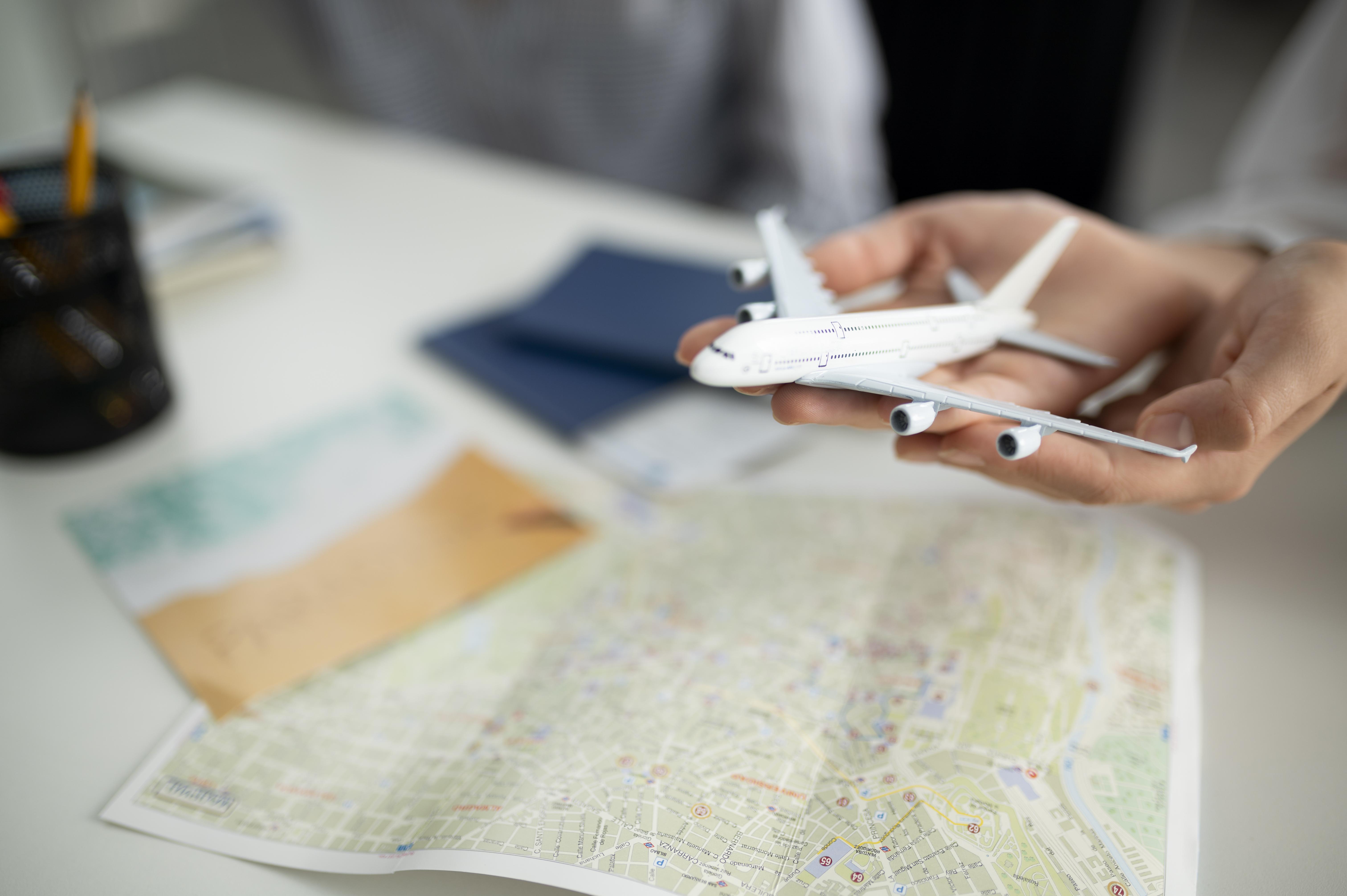 close-up-hands-holding-small-plane