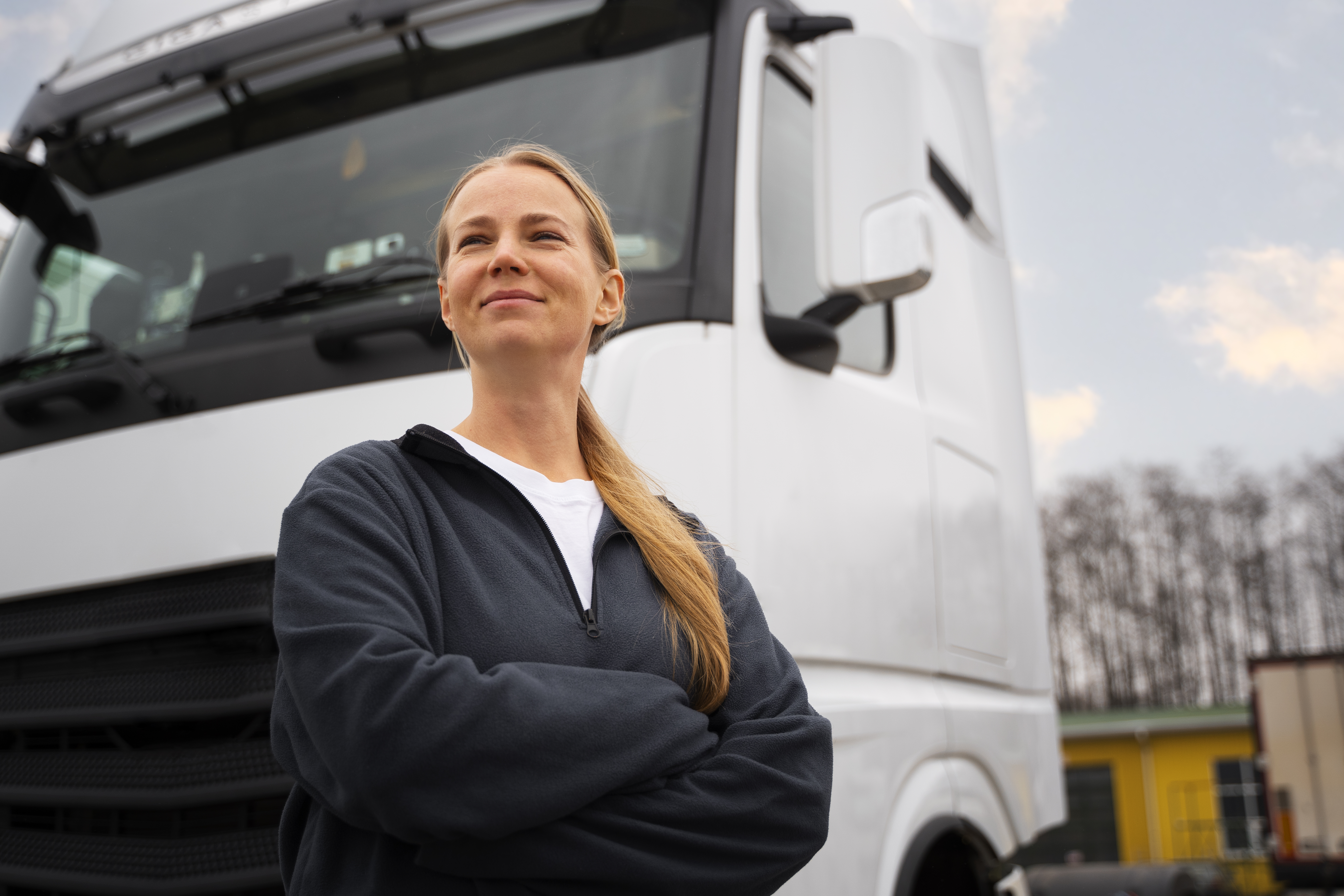 medium-shot-professional-female-driver-outdoors